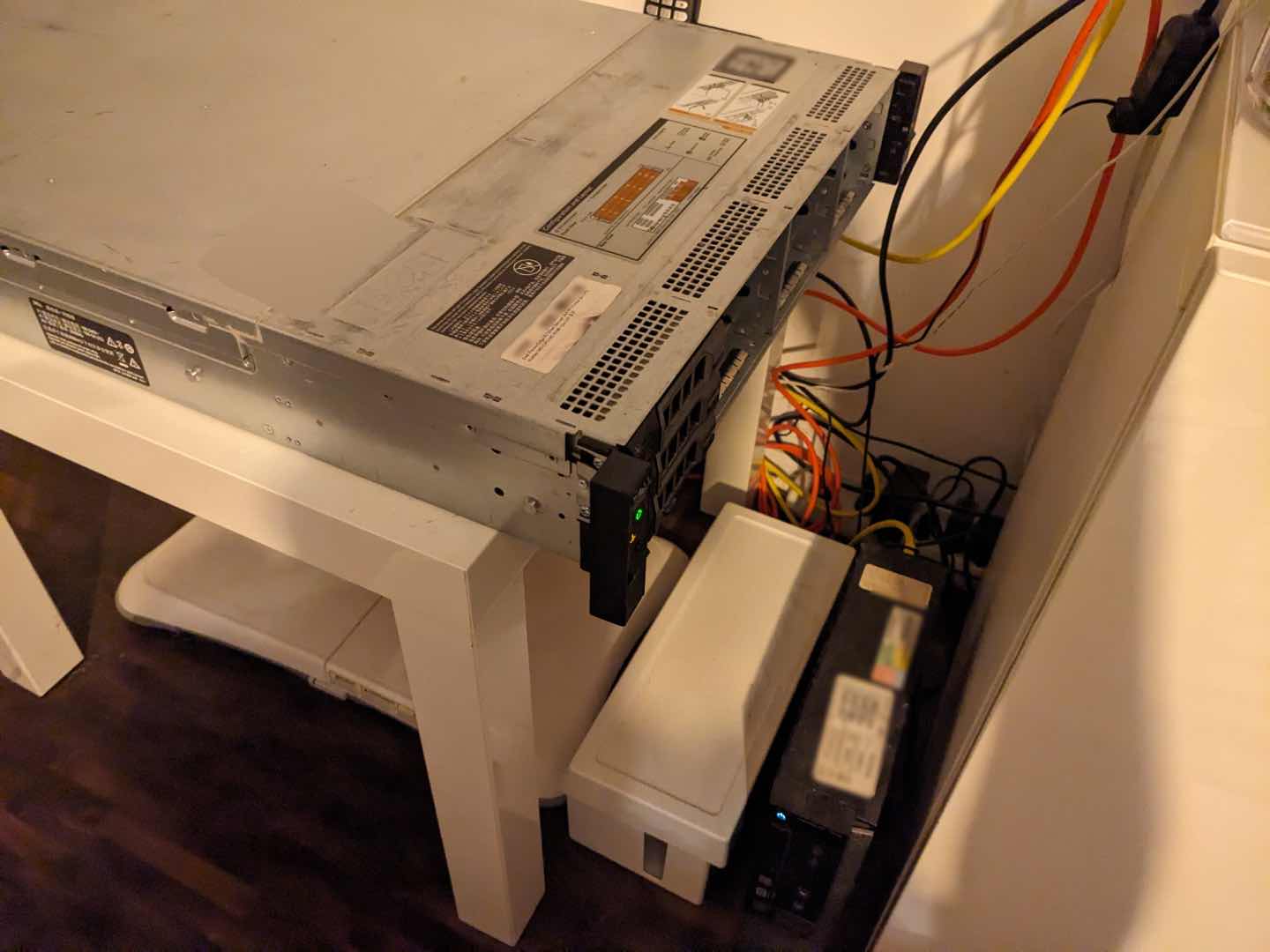 My server resting on an IKEA coffee table next to a TV